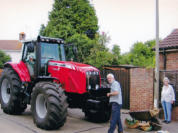 He has just brought home his new tractor and fiddling with the accessories and bits and pieces