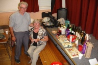 David Bracci & Doris (Chapman) Bracci beside the many raffle prizes