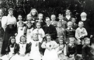 Fowlness School 1897 (for regular attendance) *BACK ROW* 1 Mrs Leeds 2 Ann Cripps 3 Millie Dowsett 4 Toss Wife 5 Emily Cottis 6 Spencer Belton 7 Bert Ballenger 8 Mr Leeds 9 Herbert Bird 10 Mr Marsh Snr *MIDDLE ROW* 1 Nellie Potton 2 Mabel Whent 3 Phyllis Dobson 4 Rev Marsh 5 