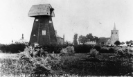 Barling Windmill (without sails) showing All Saints Church