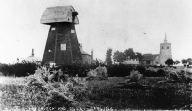 Barling Windmill (without sails) showing All Saints Church