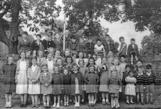 LARGER GROUP OF CHILDREN ON GREAT WAKERING CHURCH CORNER AT THE CORONATION EVENT IN 1953
