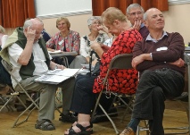 Mixed Group watching and listening to Keith “Badger” Price