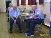 David Bailey and Laurence Street Deep in Discussion