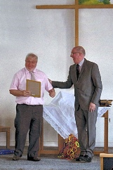 Terry Galley awarded a certificate in recognition of 55 years of organ playing by Rev. Norman Hooks 2015