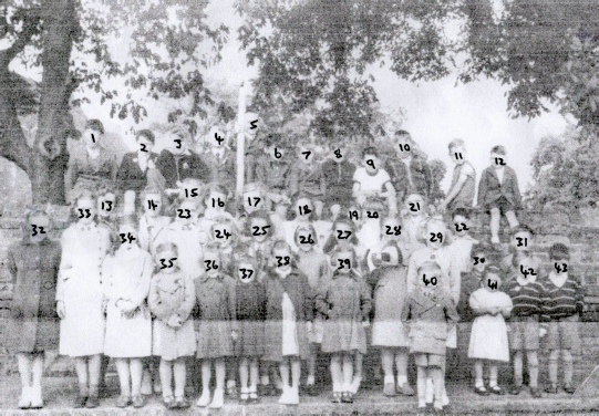 LARGER GROUP OF CHILDREN ON GREAT WAKERING CHURCH CORNER AT THE CORONATION EVENT IN 1953