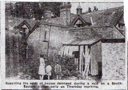 This photograph taken from the back of the Old Barling School shows two workmen on the apex of the roof